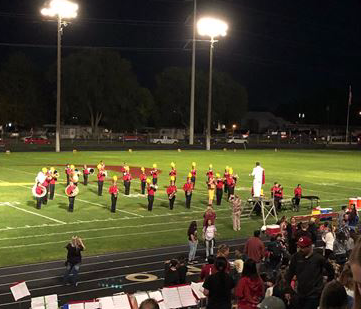 Ontario High School marching band on field under lights