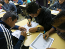 students writing at desk
