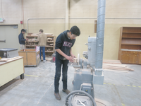 student working in shop